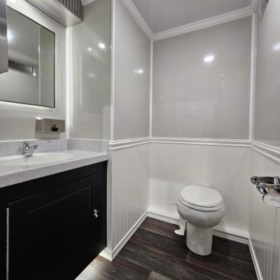 Step inside our luxury washroom trailer, and you'll be greeted by a sophisticated, modern design that blends elegance with functionality.